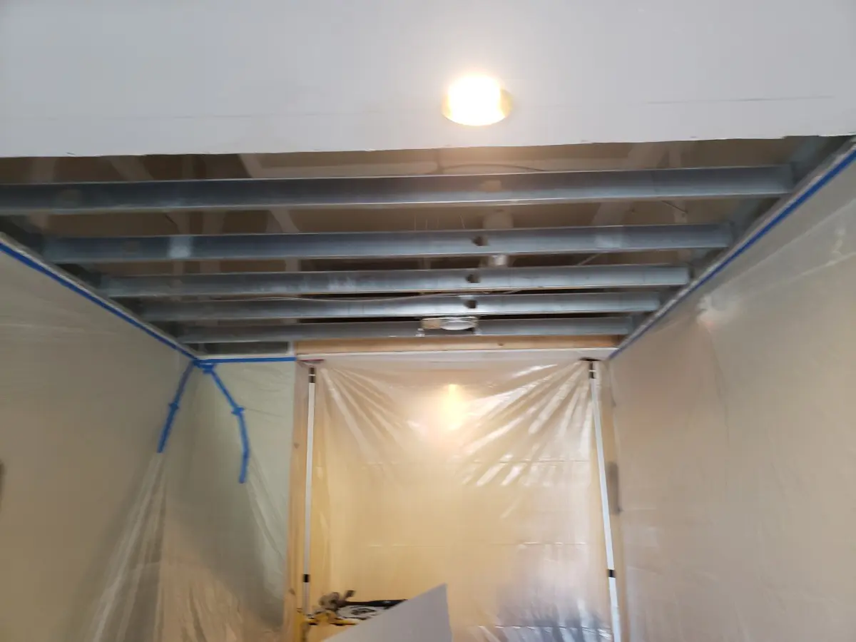 A room with some kind of ceiling that is being installed